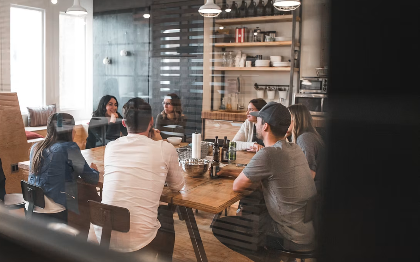 Team collaborating around a table in a modern office