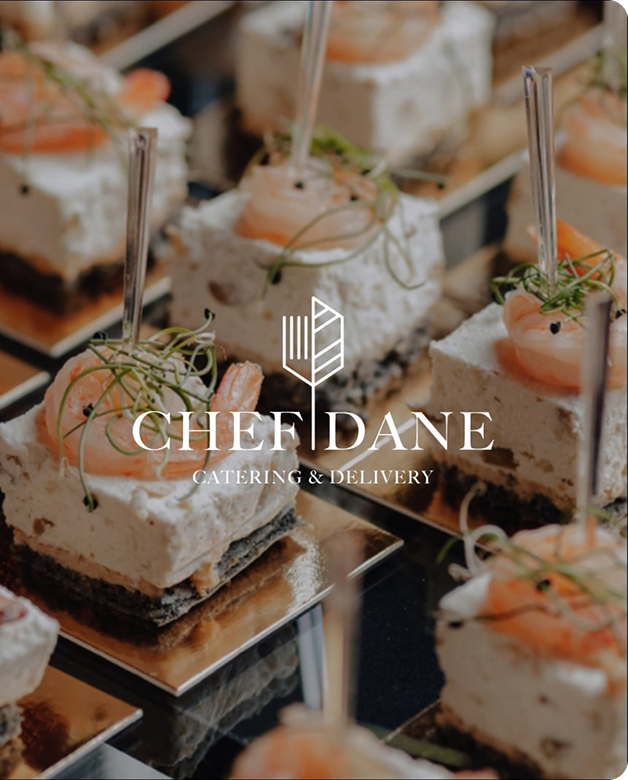 Chef Dane catering logo over a display of plated shrimp canapés