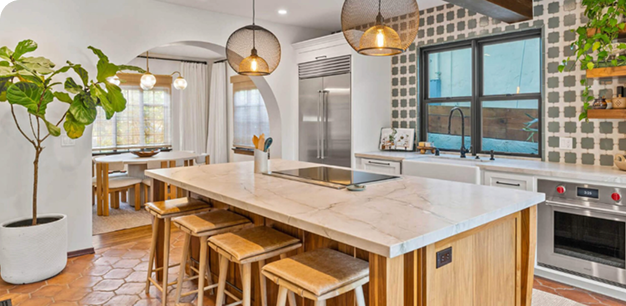 Renovated kitchen with pendant lighting and a patterned tile backsplash