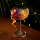 Craft cocktail garnished with an orange twist